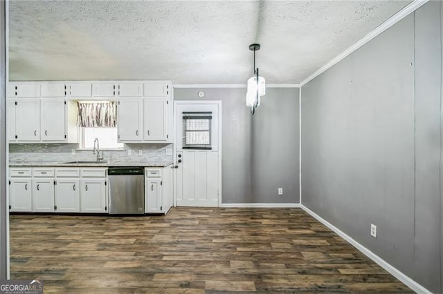 kitchen with white cabinets, decorative light fixtures, sink, and dishwasher