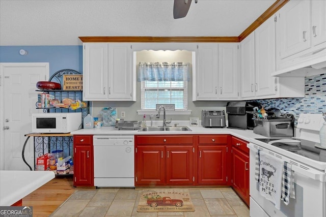 kitchen with sink, white appliances, ceiling fan, tasteful backsplash, and white cabinets