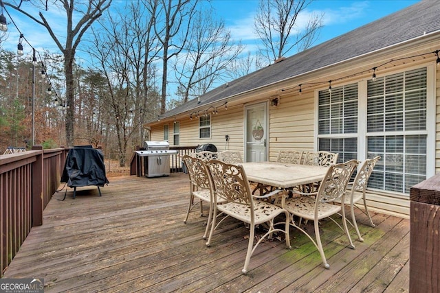 wooden terrace featuring area for grilling