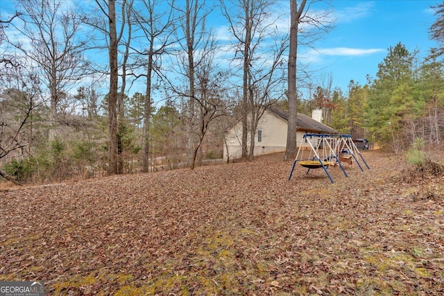 view of yard with a playground