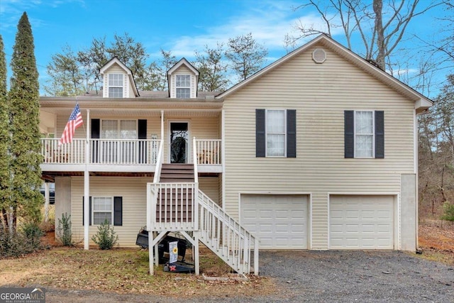 view of front of property with a garage and a porch