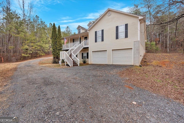 front of property featuring a garage and covered porch