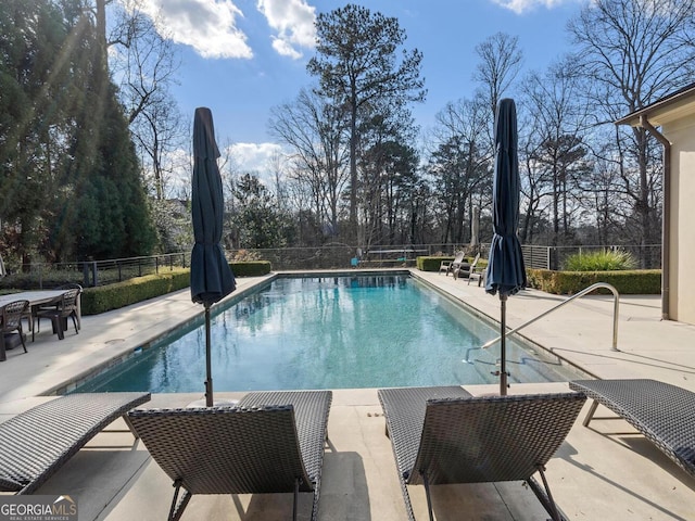 1500 W Wesley Rd NW, Atlanta, GA 30327 - view of swimming pool featuring a patio, a fenced in pool, and a fenced backyard