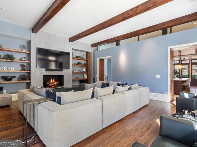 1500 W Wesley Rd NW, Atlanta, GA 30327 - living area with a large fireplace, built in features, baseboards, dark wood-type flooring, and beamed ceiling