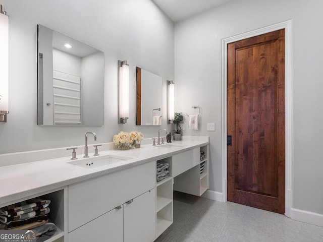 1500 W Wesley Rd NW, Atlanta, GA 30327 - bathroom featuring double vanity, baseboards, recessed lighting, and a sink
