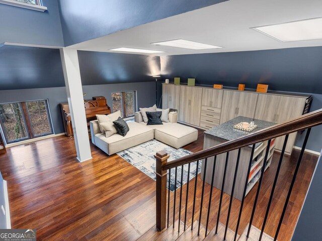 1500 W Wesley Rd NW, Atlanta, GA 30327 - living room with wood finished floors and vaulted ceiling
