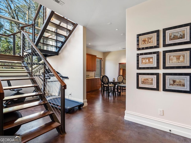 1500 W Wesley Rd NW, Atlanta, GA 30327 - stairs with baseboards, recessed lighting, finished concrete floors, and visible vents