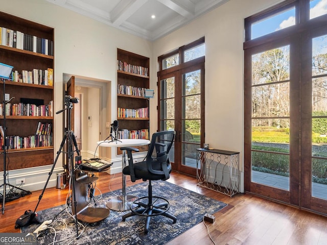 1500 W Wesley Rd NW, Atlanta, GA 30327 - home office featuring coffered ceiling, wood finished floors, built in shelves, and beamed ceiling