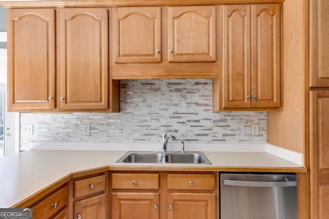 kitchen with tasteful backsplash, dishwasher, and sink