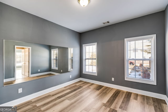 empty room featuring hardwood / wood-style flooring