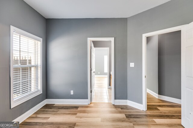 unfurnished bedroom with light wood-type flooring