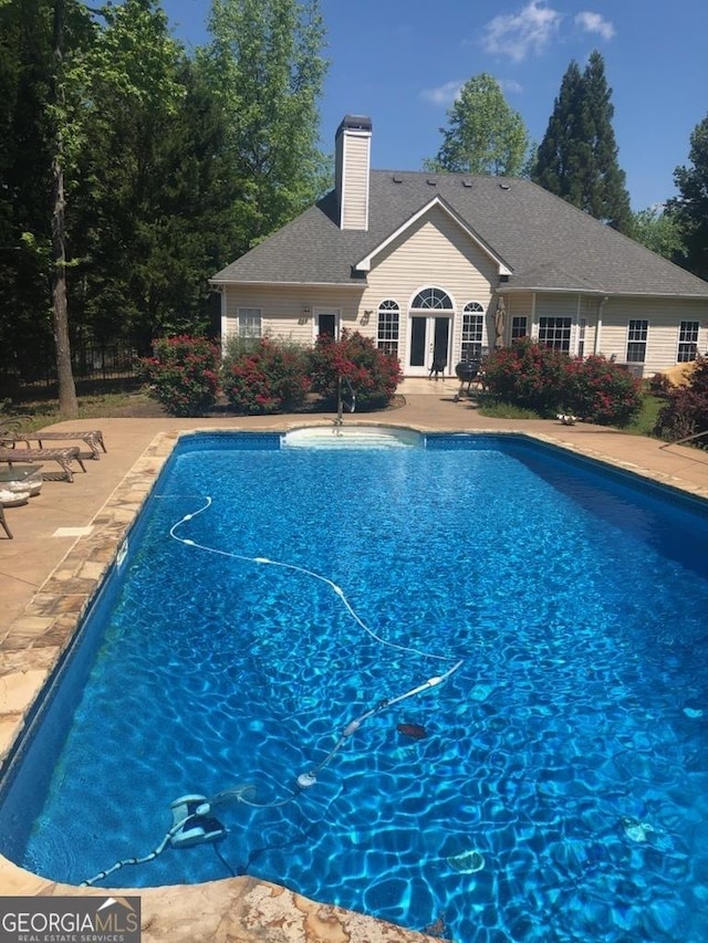 view of swimming pool with a patio area