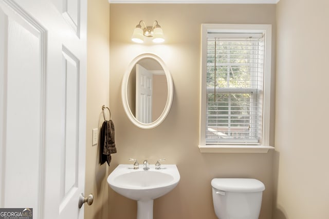 bathroom with toilet and sink