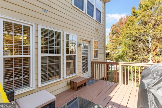 wooden deck with area for grilling