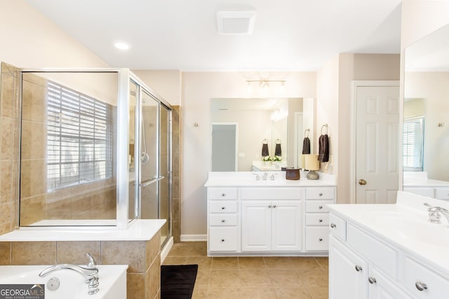 bathroom with tile patterned floors, plus walk in shower, and vanity