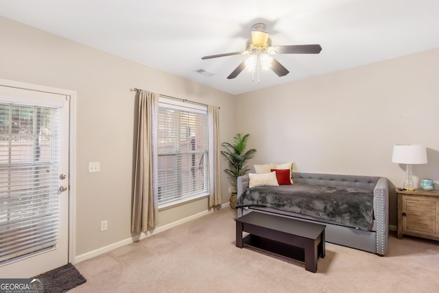 carpeted bedroom featuring ceiling fan