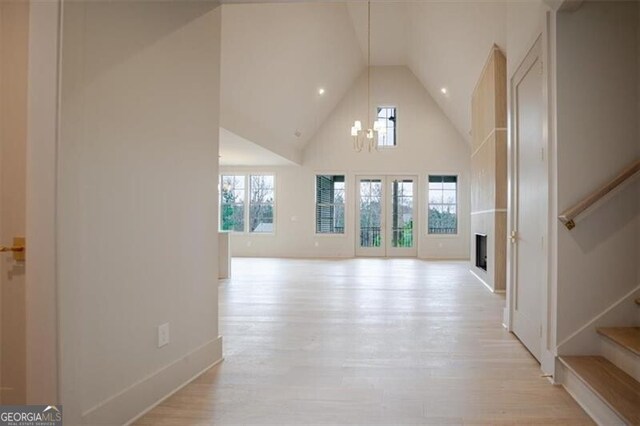 dining space featuring vaulted ceiling and light hardwood / wood-style floors