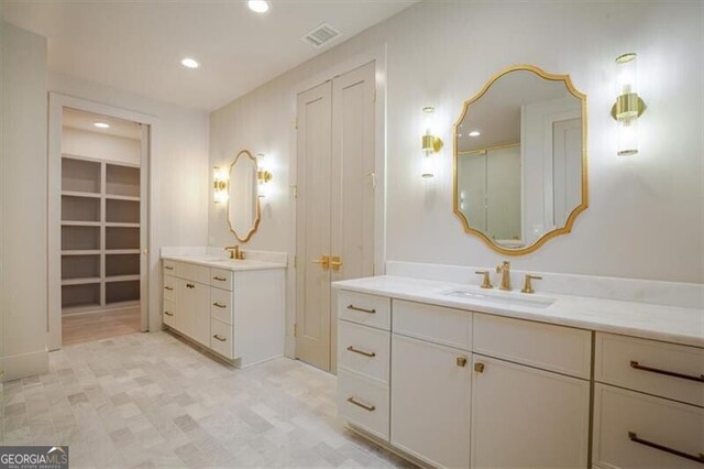 bathroom with vanity, hardwood / wood-style floors, and a shower with shower door