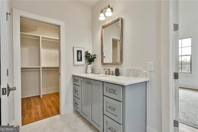 bathroom featuring tile patterned flooring and vanity