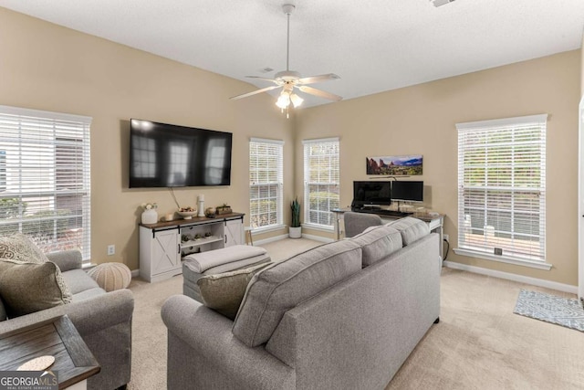 living room with light colored carpet and ceiling fan