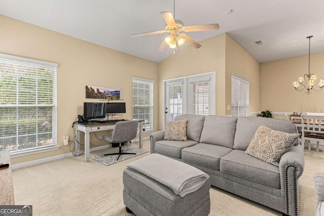 living room featuring ceiling fan with notable chandelier, lofted ceiling, a healthy amount of sunlight, and light colored carpet