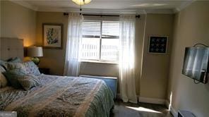 bedroom featuring crown molding