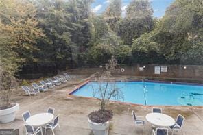 view of swimming pool with a patio