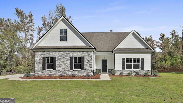 craftsman-style house with a front yard