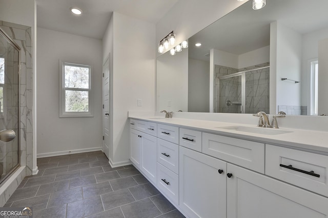 bathroom with vanity and a shower with shower door