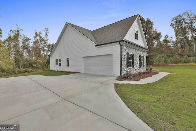 view of property exterior with a garage and a yard