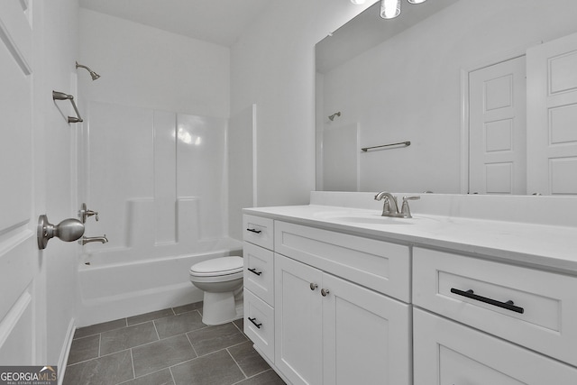 full bathroom with vanity, tub / shower combination, tile patterned floors, and toilet