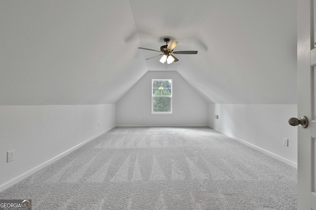 bonus room featuring ceiling fan, light colored carpet, and vaulted ceiling