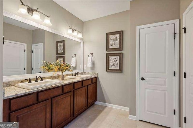 bathroom with vanity and tile patterned flooring