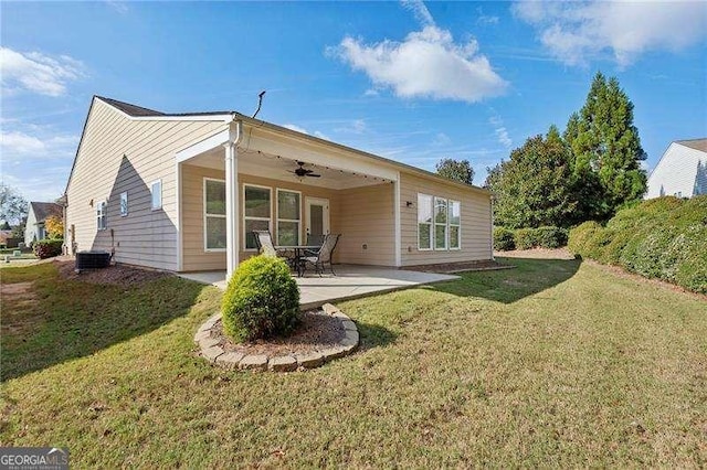 rear view of house with a patio, a yard, ceiling fan, and central air condition unit