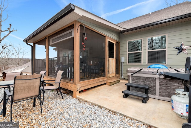 view of patio / terrace featuring a sunroom