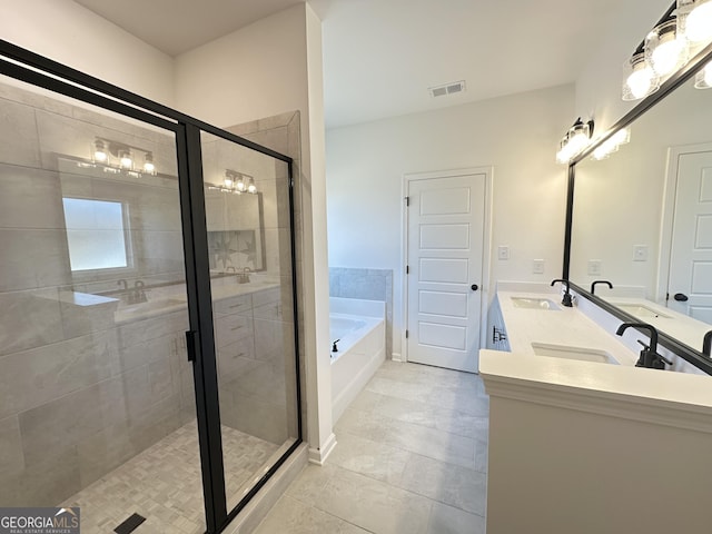 bathroom featuring vanity, tile patterned floors, and separate shower and tub