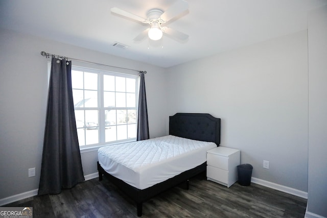 bedroom featuring dark hardwood / wood-style flooring and ceiling fan