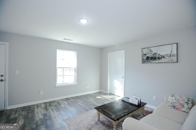 unfurnished living room featuring hardwood / wood-style floors