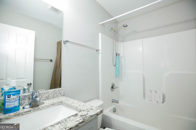 full bathroom with vanity, tub / shower combination, and toilet