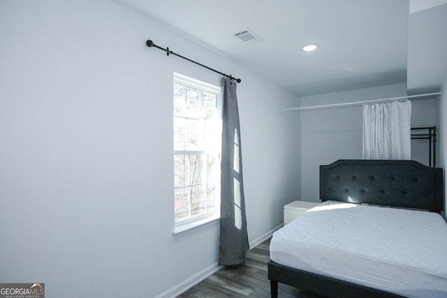 bedroom featuring dark hardwood / wood-style flooring