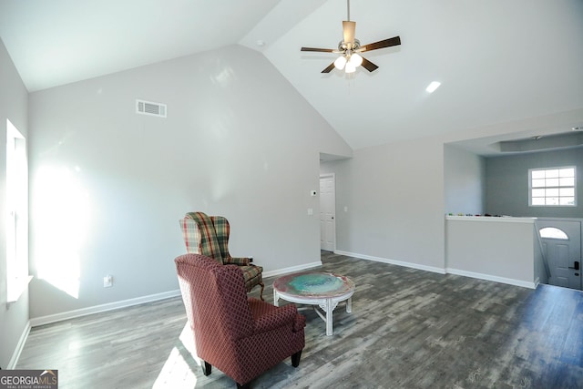 sitting room with ceiling fan, hardwood / wood-style floors, and high vaulted ceiling