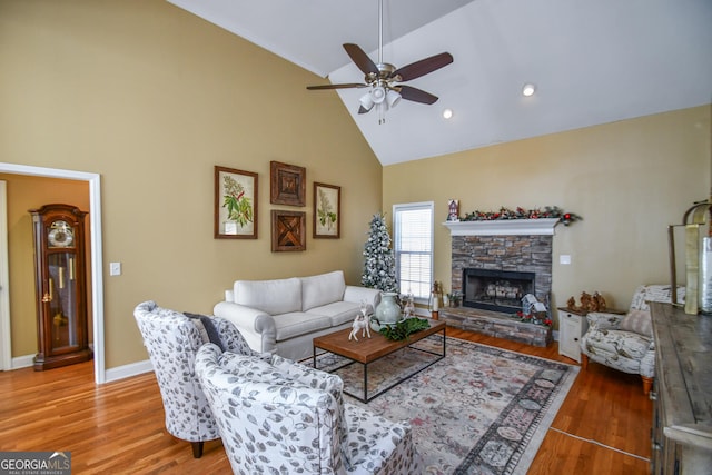 68 Glencrest Dr, Commerce, GA 30529 - living room featuring ceiling fan, wood-type flooring, a stone fireplace, and high vaulted ceiling