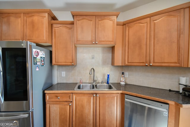 kitchen featuring tasteful backsplash, sink, and stainless steel appliances