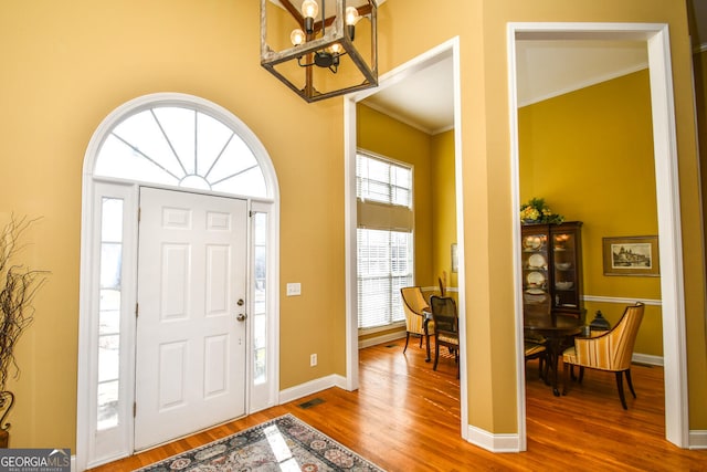 68 Glencrest Dr, Commerce, GA 30529 - foyer entrance featuring hardwood / wood-style floors, a notable chandelier, and ornamental molding