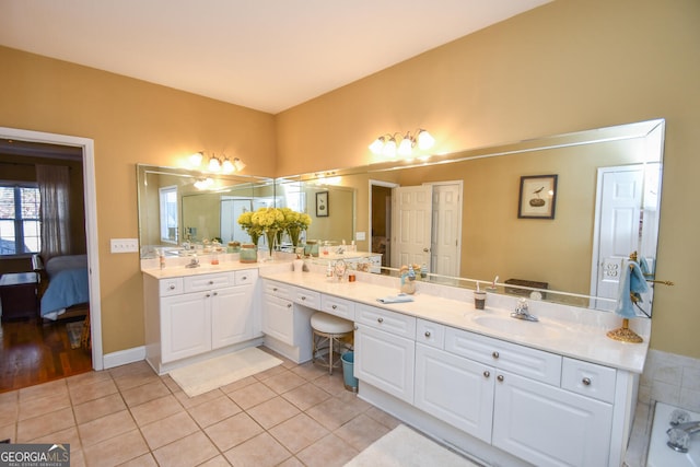 bathroom with vanity and tile patterned flooring