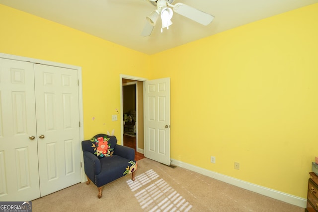 unfurnished room featuring light carpet and ceiling fan