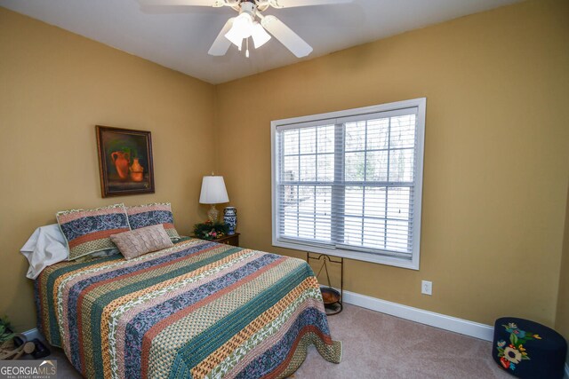 carpeted bedroom with ceiling fan