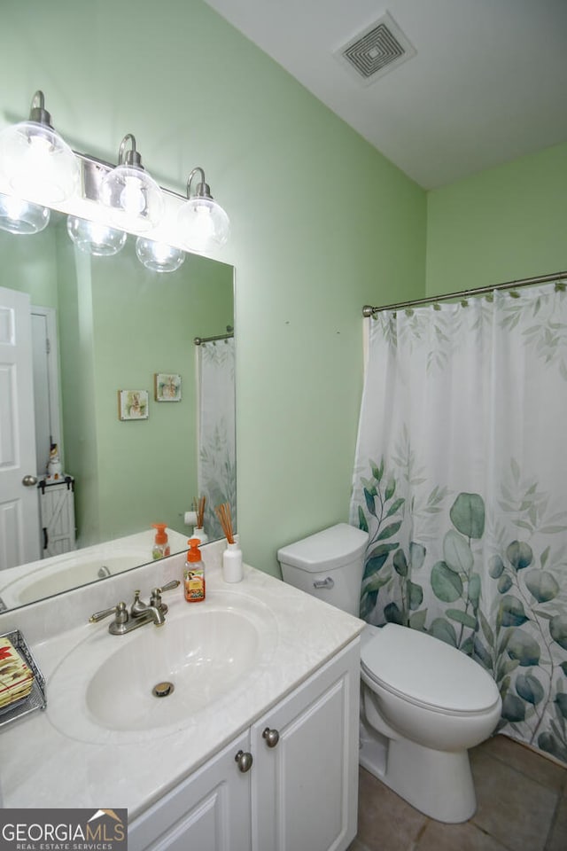 bathroom with vanity, tile patterned flooring, toilet, and a shower with shower curtain