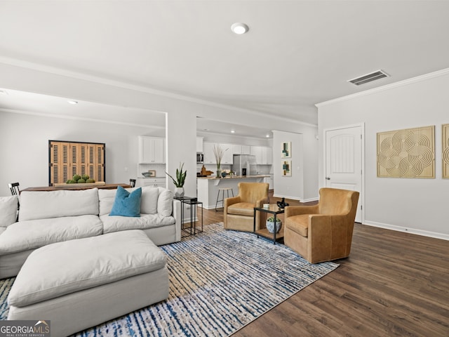 living room featuring crown molding and dark hardwood / wood-style flooring