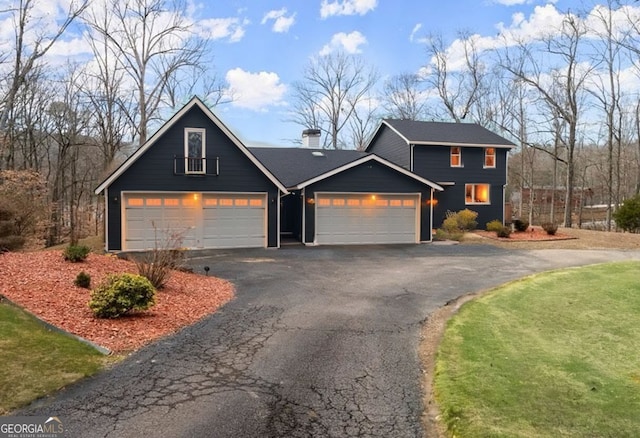 3366 Small Woods Ln, Gainesville, GA 30506 - view of front facade featuring a chimney, driveway, and an attached garage